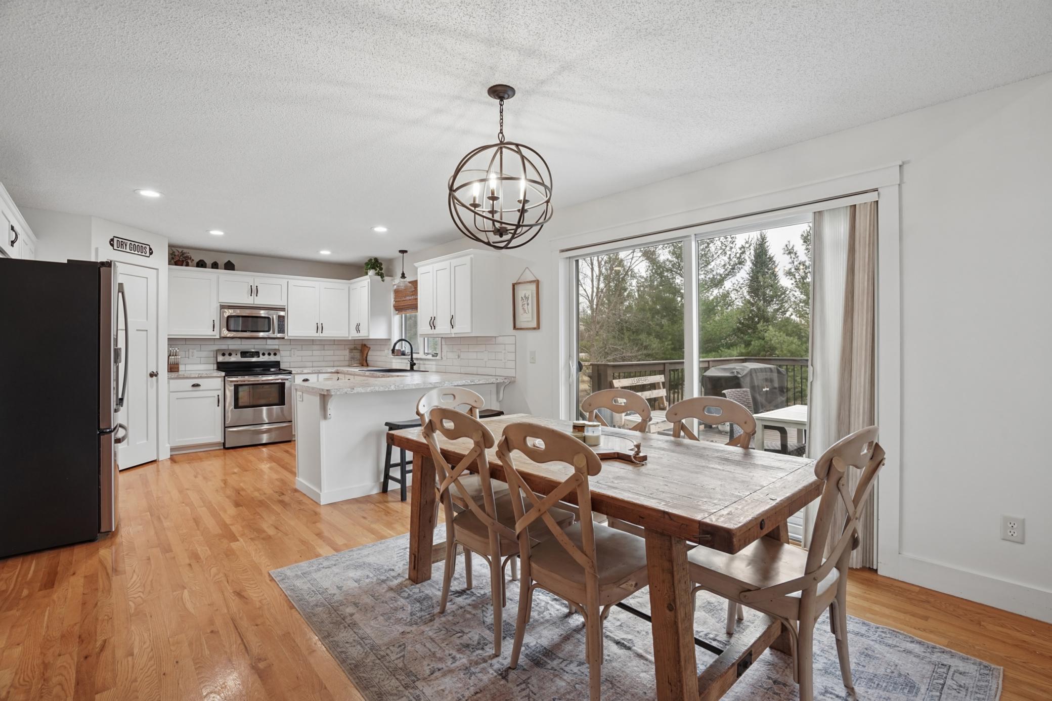 dining area is open to the kitchen and living area. Also offers an oversized slider door that opens to the beautiful backyard and deck!