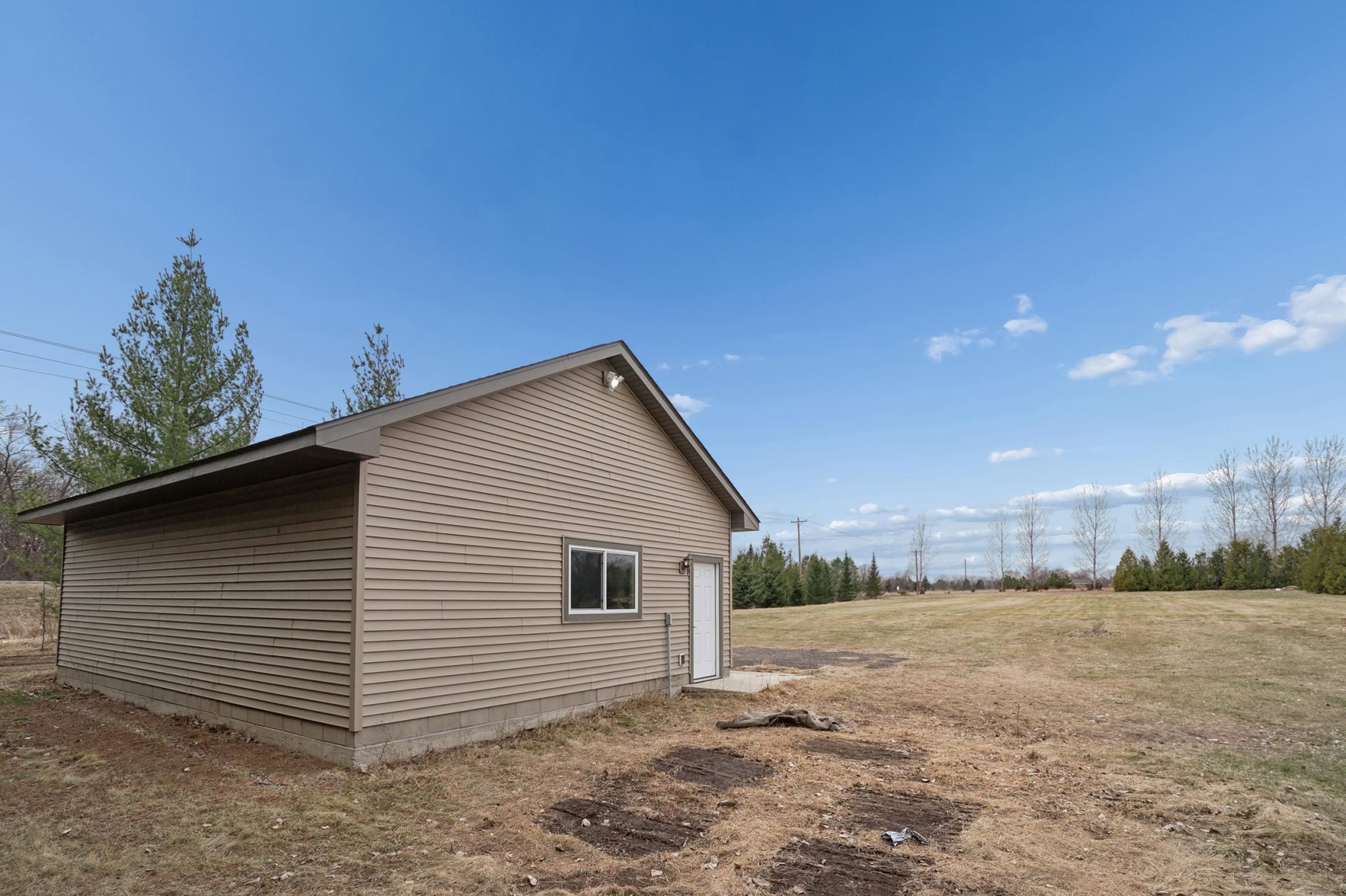 Detached 32x24 garage w/ concrete floor and electric! Bring the toys or make a workshop!