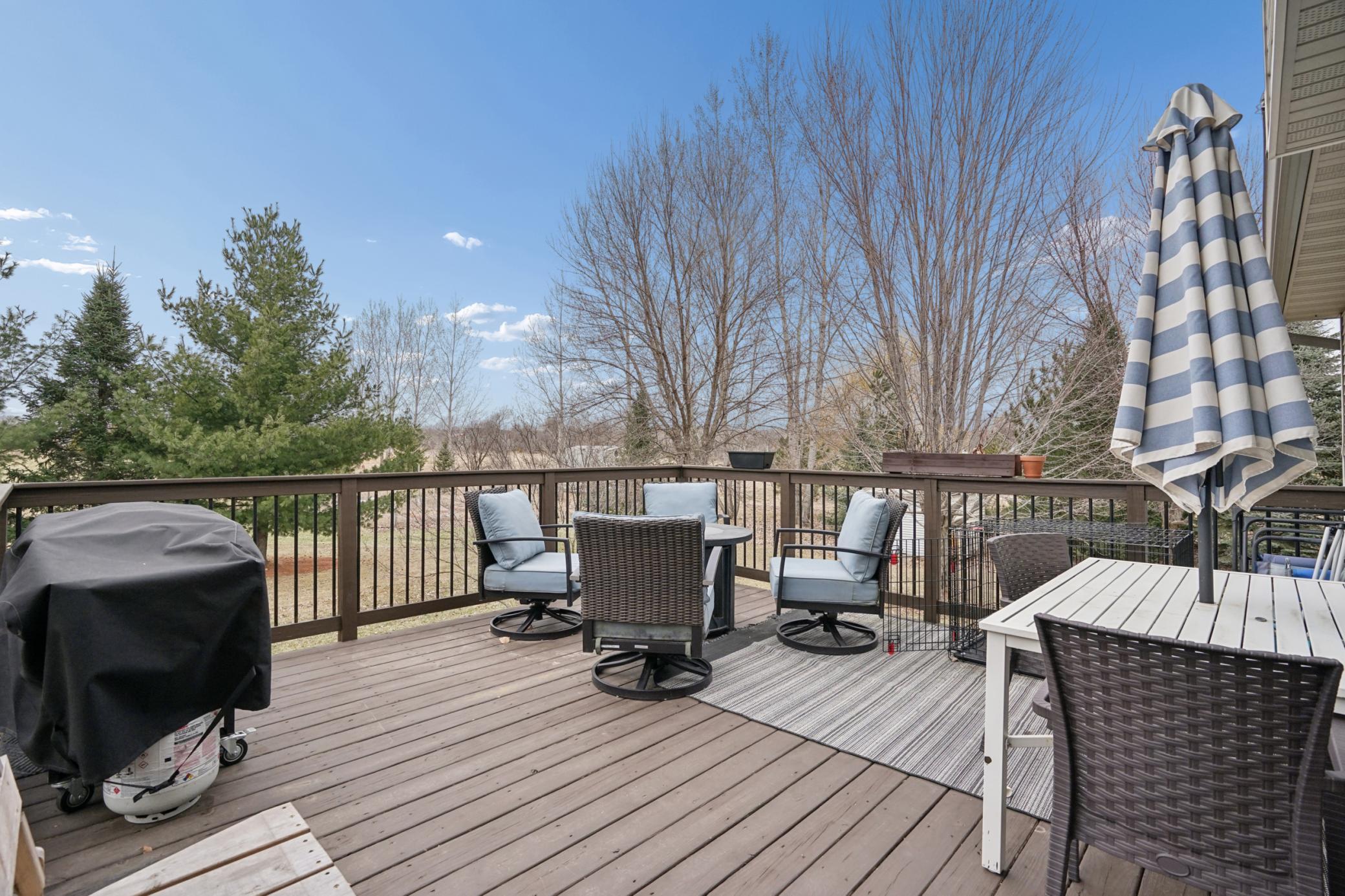 What a PERFECT space! Overlooking the private backyard and plenty of room to relax, grill, and enjoy summer evenings!!