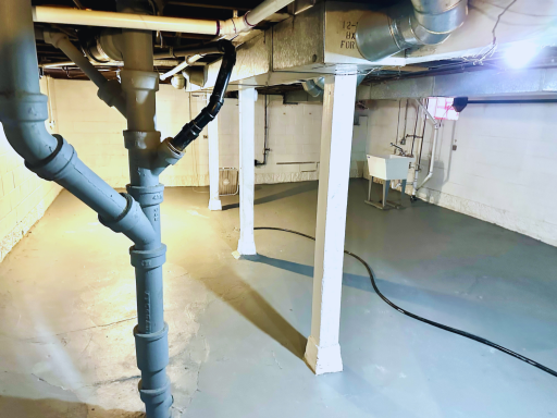 Open lower level with flexible space for storage, hobbies, or future finishing, plus dedicated laundry area.