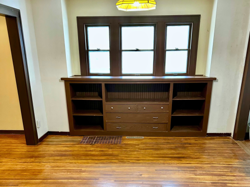 Original built-in cabinetry adds warmth, function, and vintage charm rarely found today.