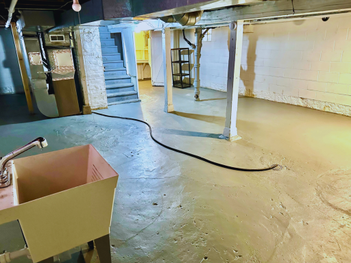 Usable lower level with space for storage, hobbies, or future finishing.