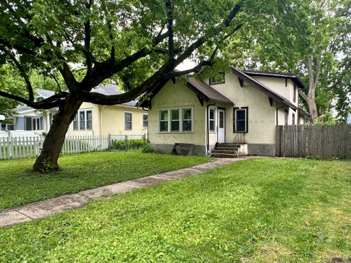 Charming bungalow with timeless character, mature trees, and a spacious yard ready for your vision.