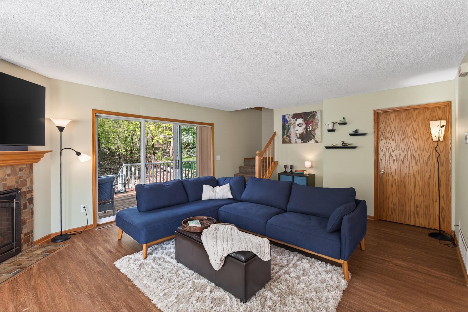 Three panel sliding door that lead to spacious deck.