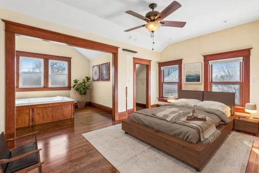 38 virtually staged primary en suite bedroom.jpg