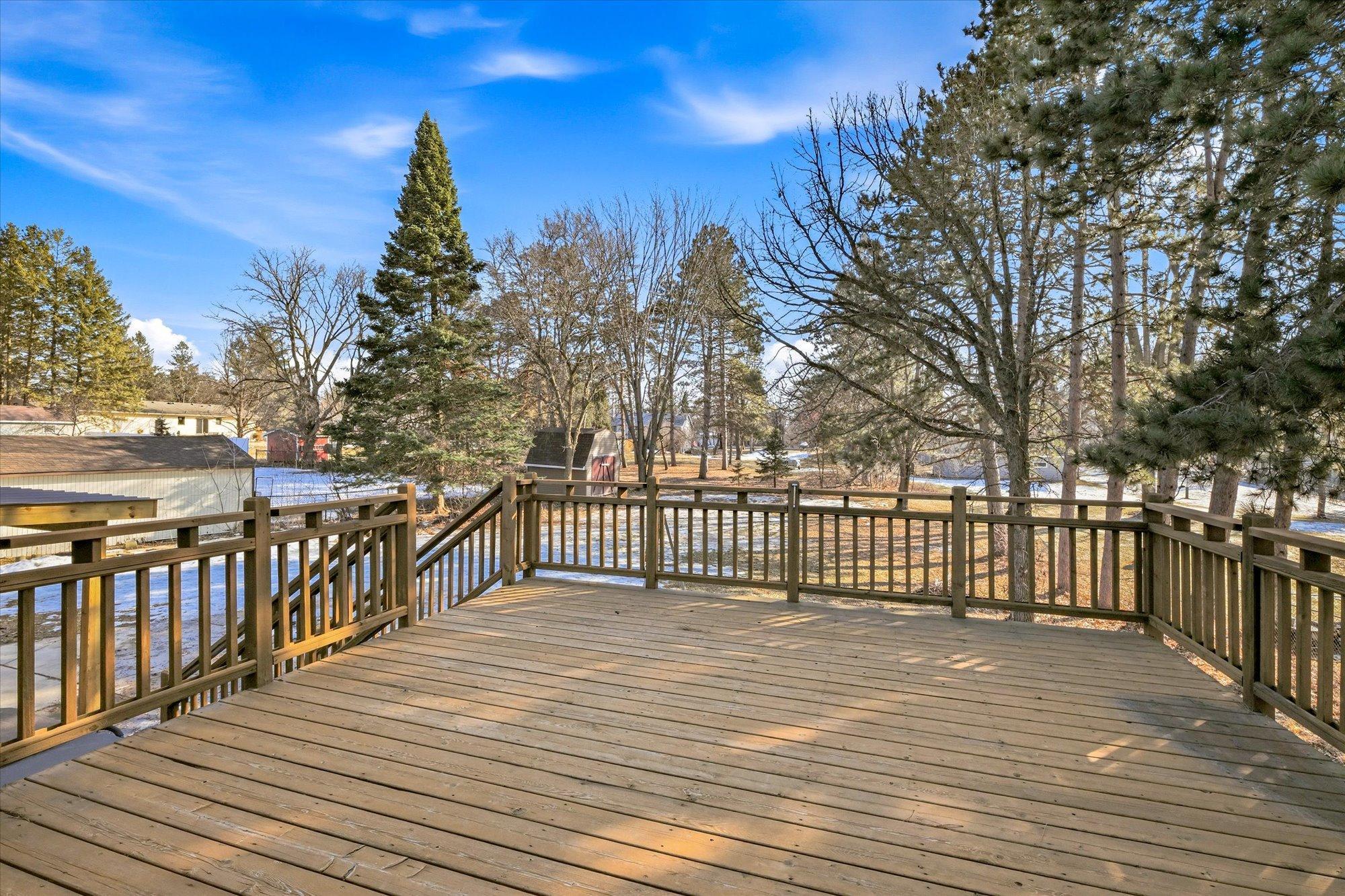 View of the large deck and backyard
