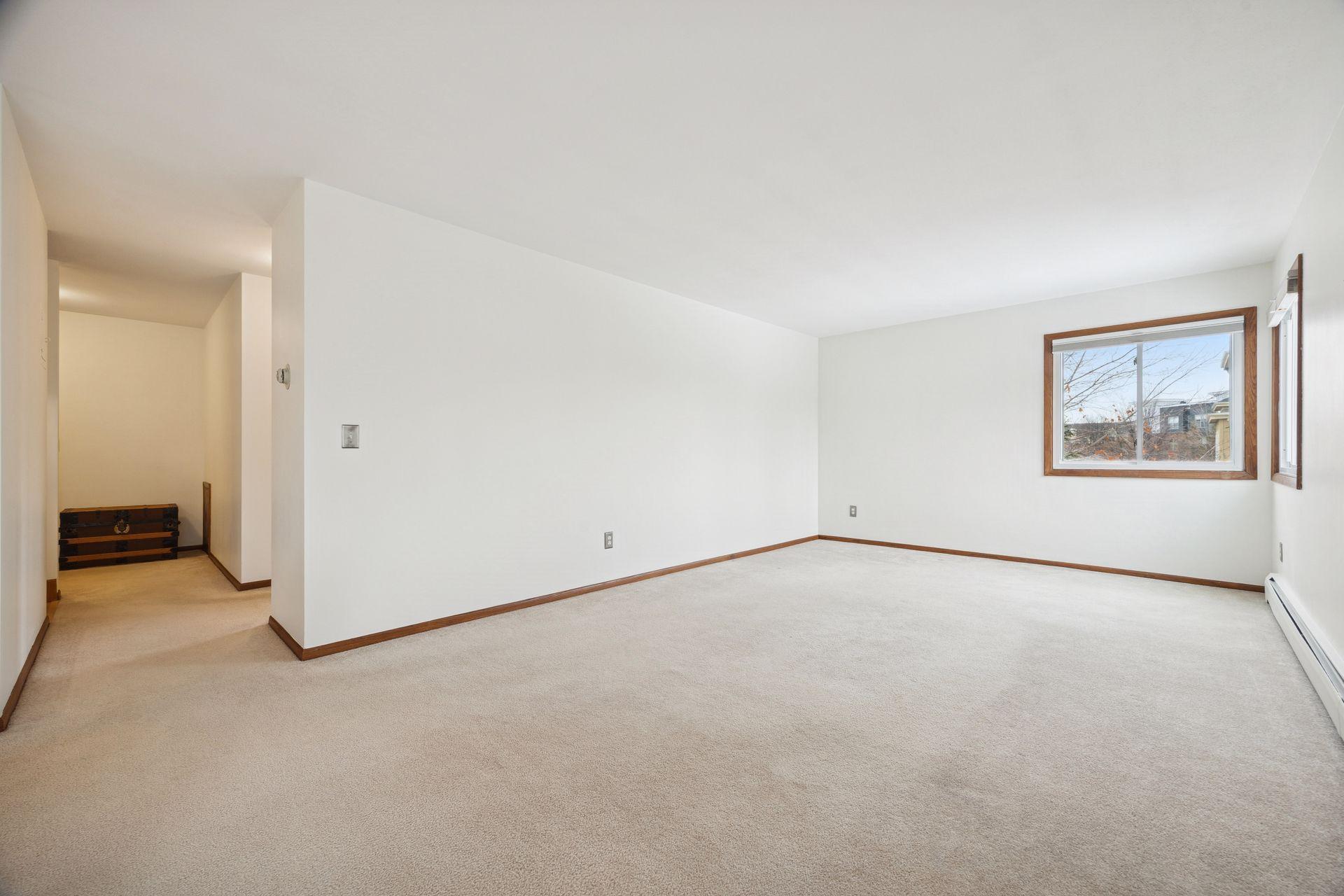 Another look at the smart layout. From the spacious living room, you can see straight down the hall to the entry, with a right hallway leading to the bedroom and bathroom.