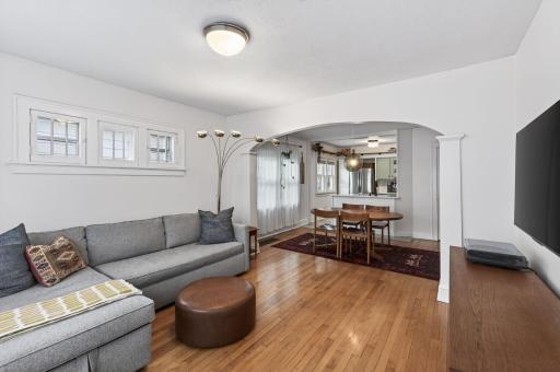 Beautiful hardwood floors, and newer paint accentuates the bright and airy living room.