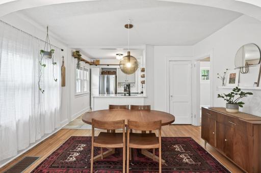 Newer light fixture complements the rich hardwood floors