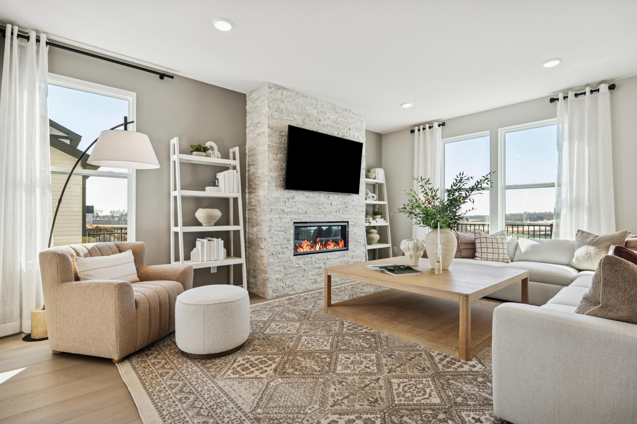 Inviting fireplace serves as a warm focal point, perfect for relaxing evenings and adding character to your home.