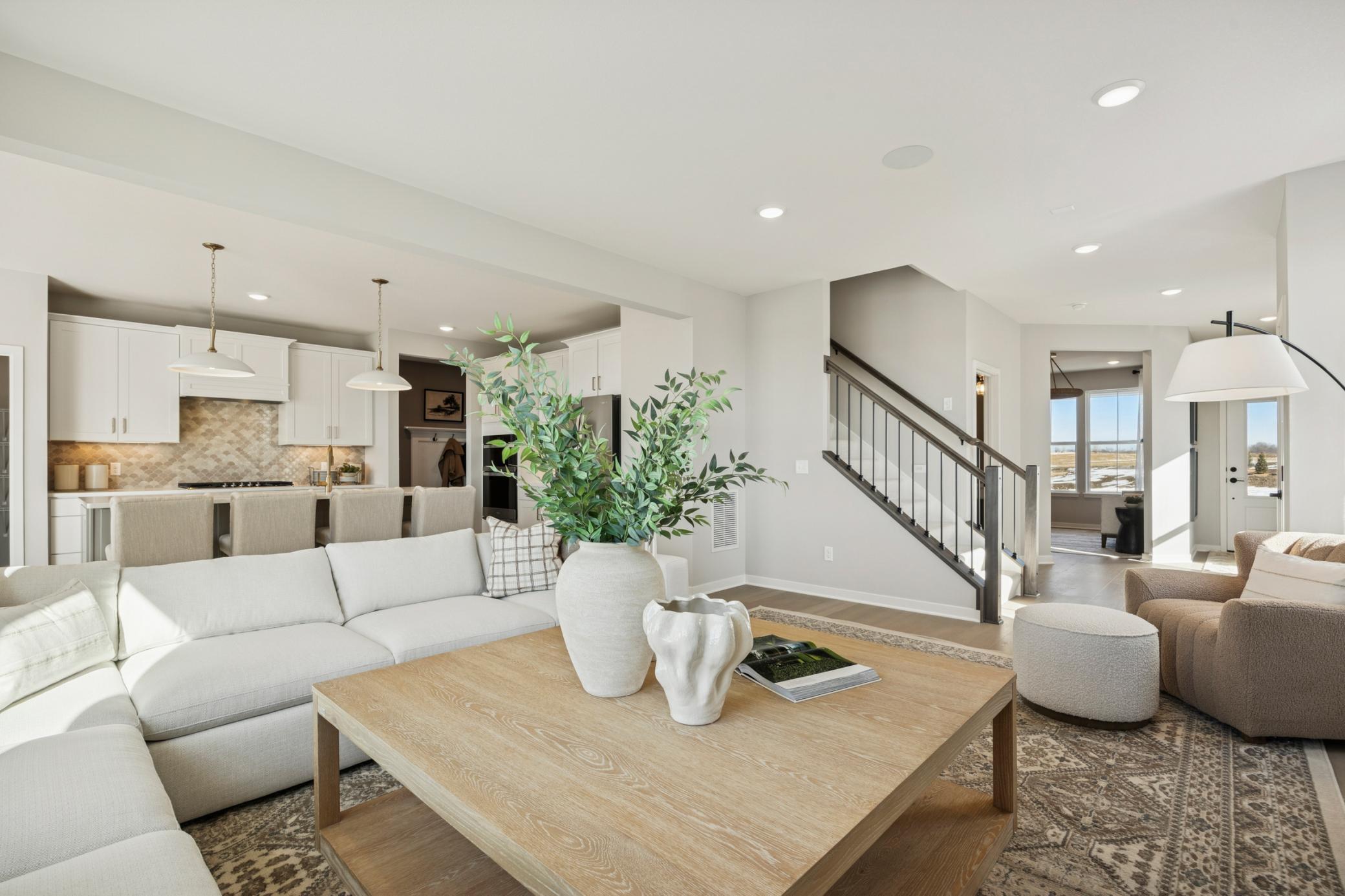 Open floorplan creates a seamless connection between the family room, kitchen, and dining areas—ideal for entertaining and family togetherness.