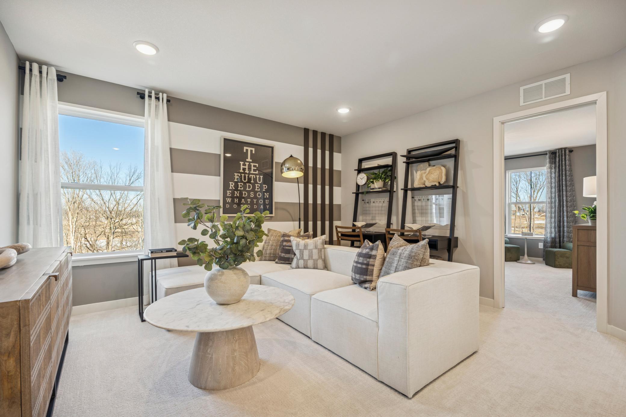 Loft’s open layout connects effortlessly to surrounding rooms, providing a bright and inviting upper-level retreat.