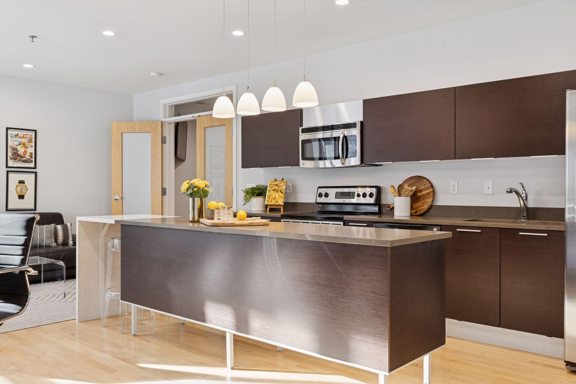 The kitchen area features Italian Valcucine cabinets & quartz countertops