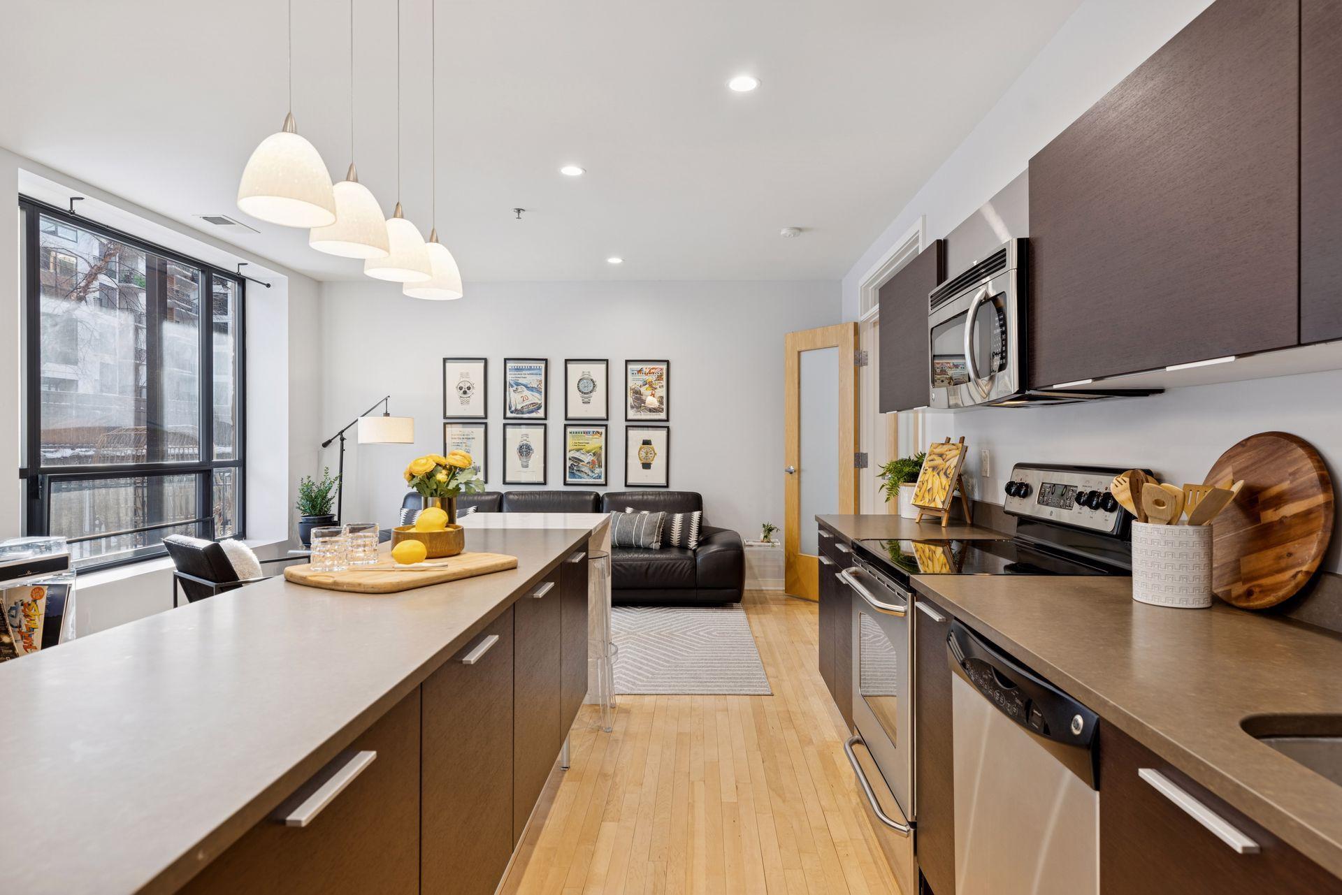 The kitchen area features Italian Valcucine cabinets & quartz countertops