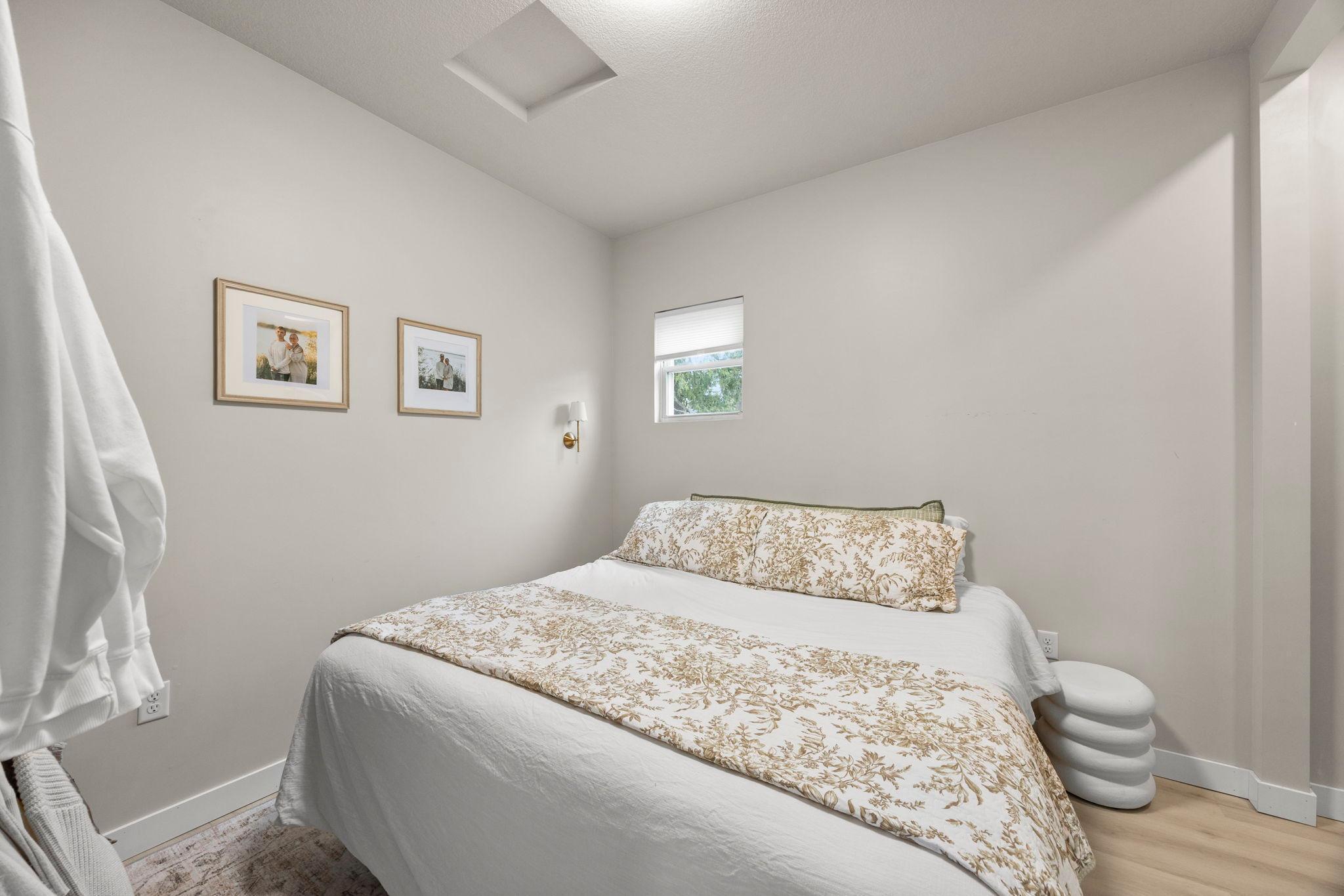 Down the hall, the bedroom offers continued luxury plank flooring and sits just steps from the stylishly updated ¾ bathroom.