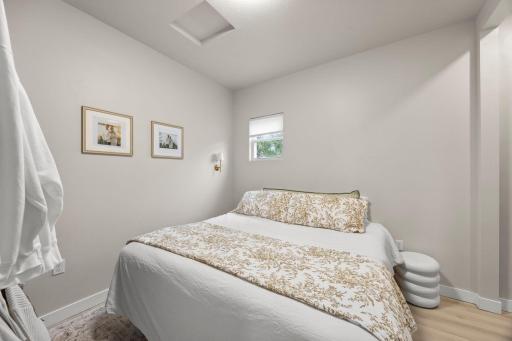 Down the hall, the bedroom offers continued luxury plank flooring and sits just steps from the stylishly updated ¾ bathroom.