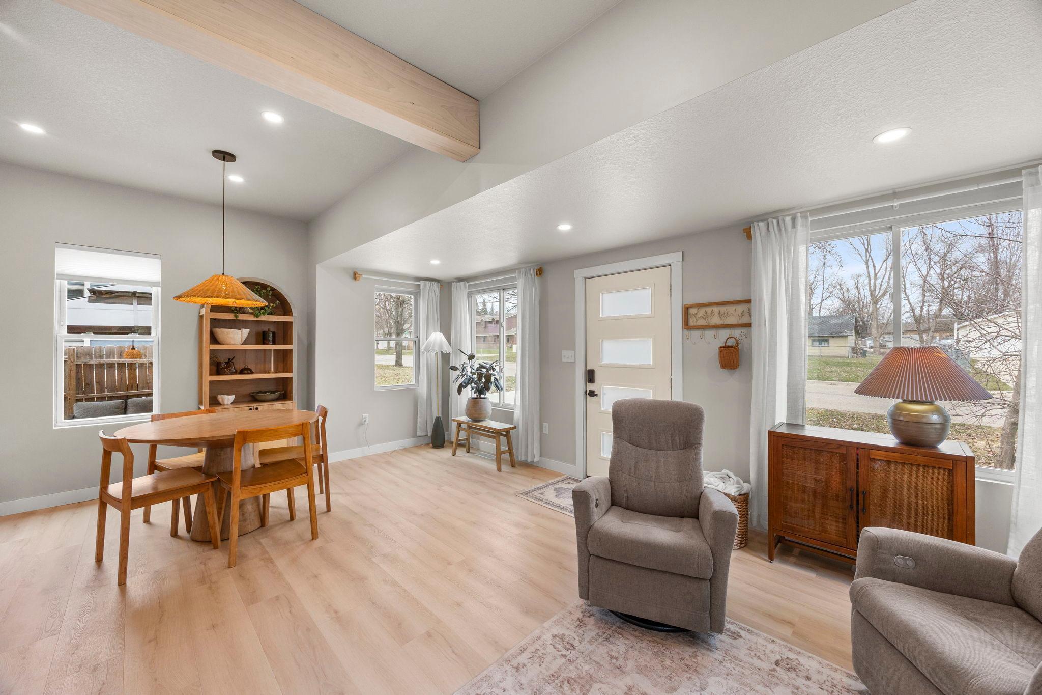 Step inside to a light-filled, open-concept main level with luxury plank flooring flowing seamlessly throughout.