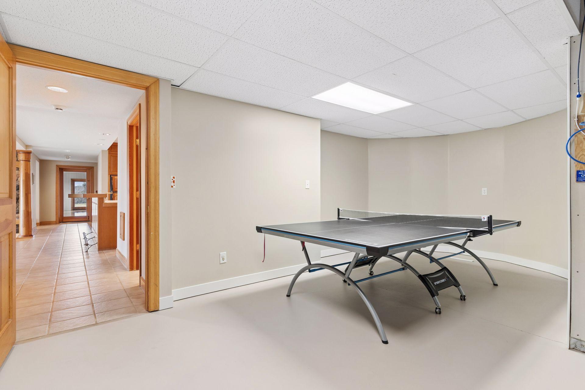 Just inside the large storage and mechanical room is where the current owners set up their ping-pong table.
