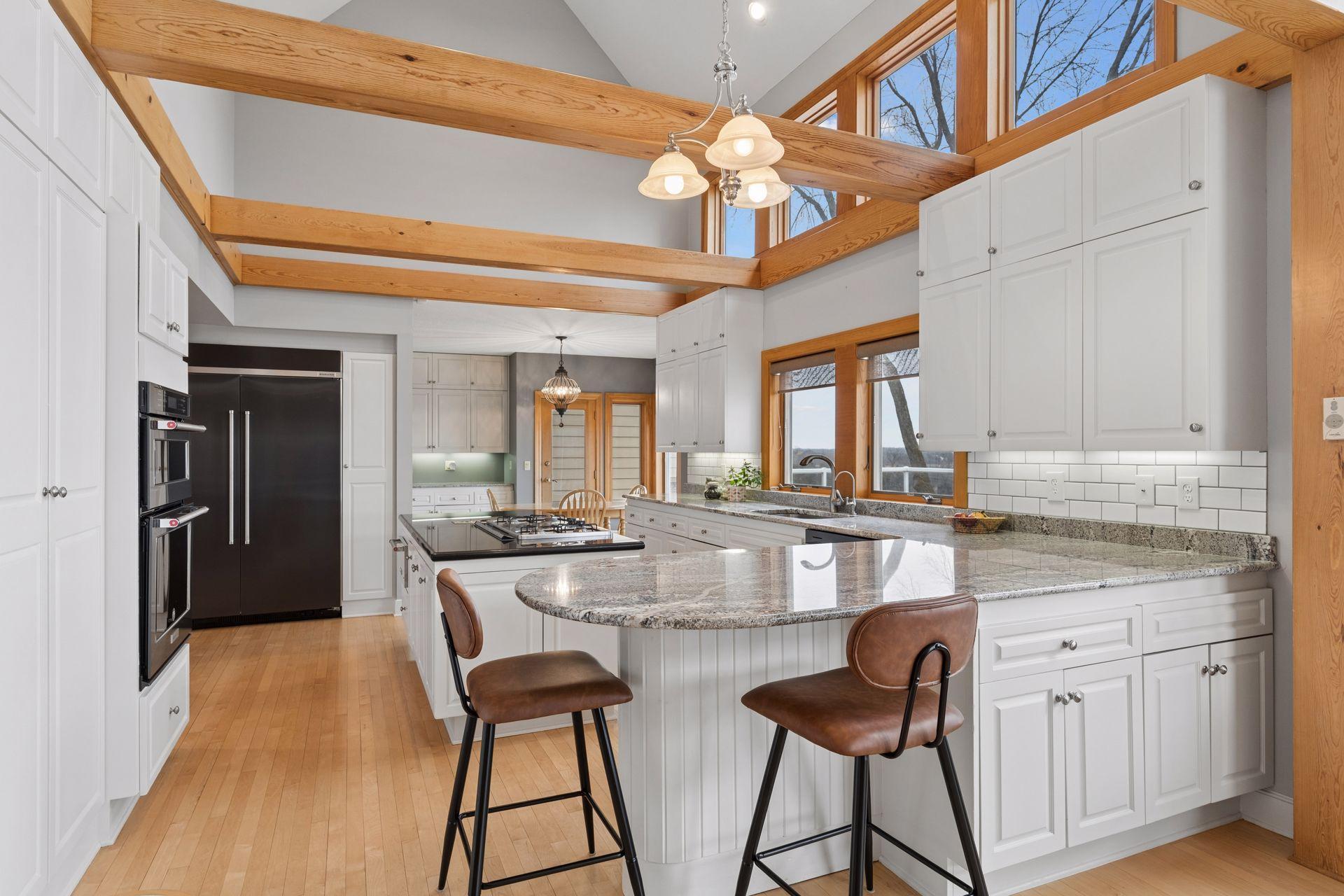 The Kitchen offers extensive cabinetry with granite countertops.