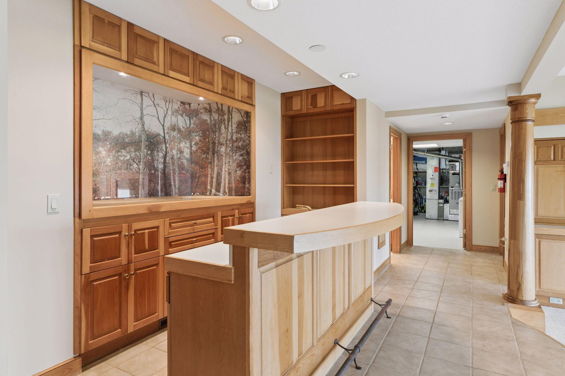 If you are cheering on your favorite sports team or enjoy a movie night, the wet bar can store your snacks and beverages!