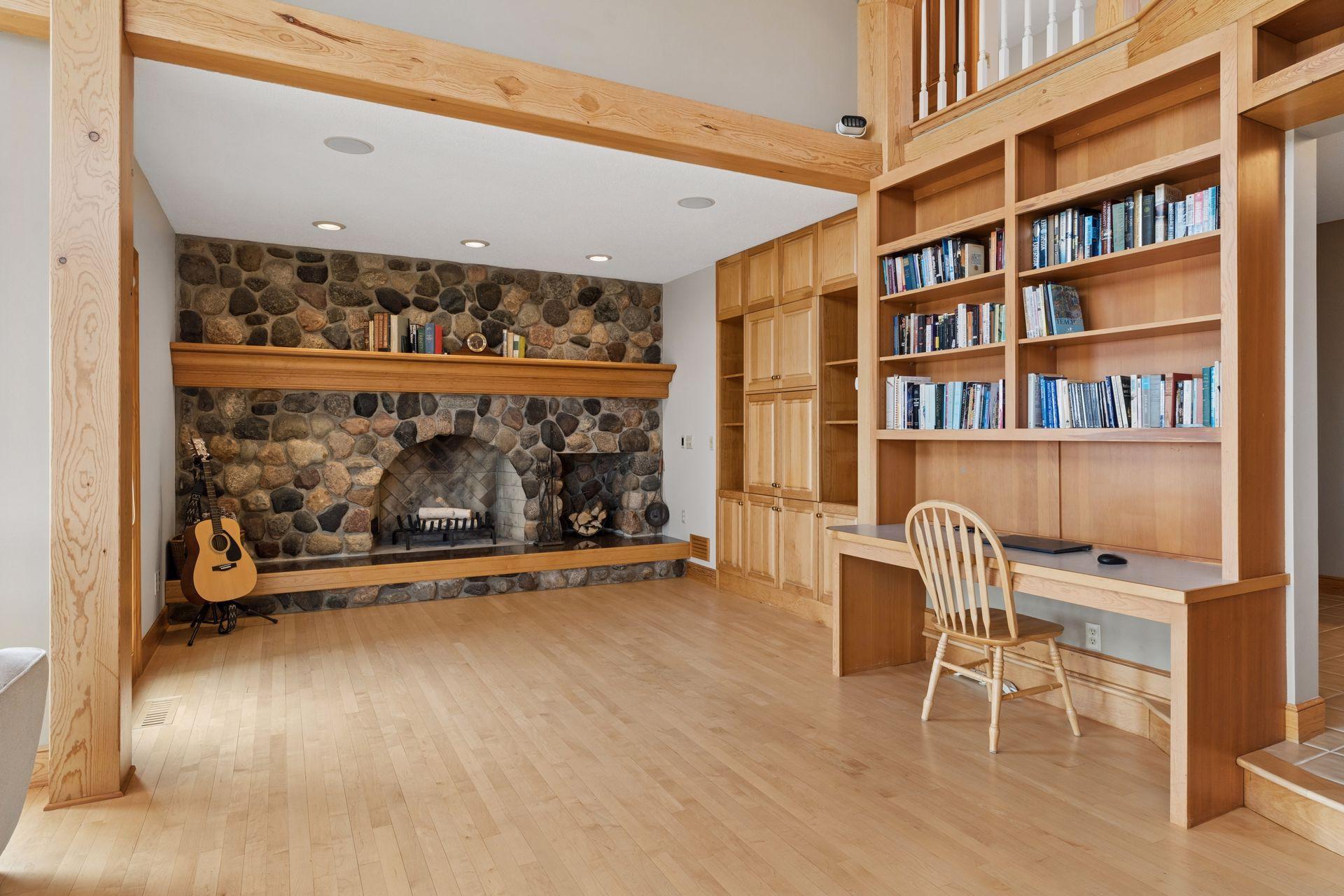 The inviting hearth room offers a wood-burning fireplace.