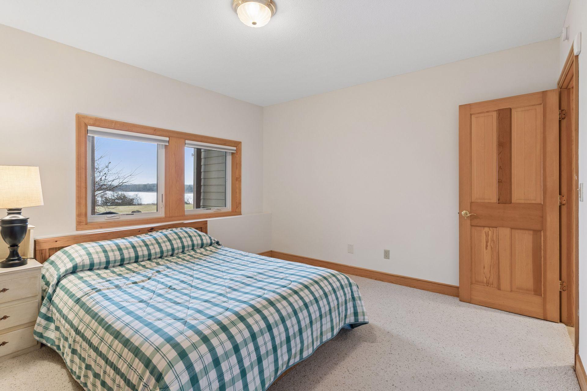 A fifth bedroom is located in the lower level and is an inviting space for guests and visitors.