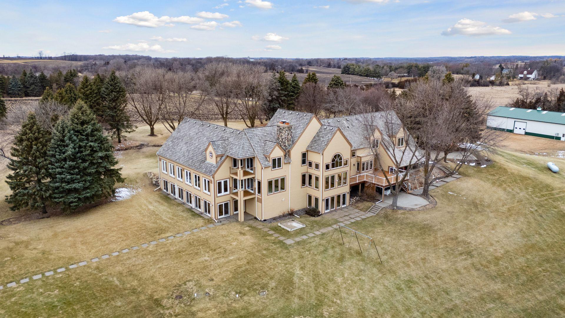 The home is nestled on nearly 118 acres of gently rolling hills.