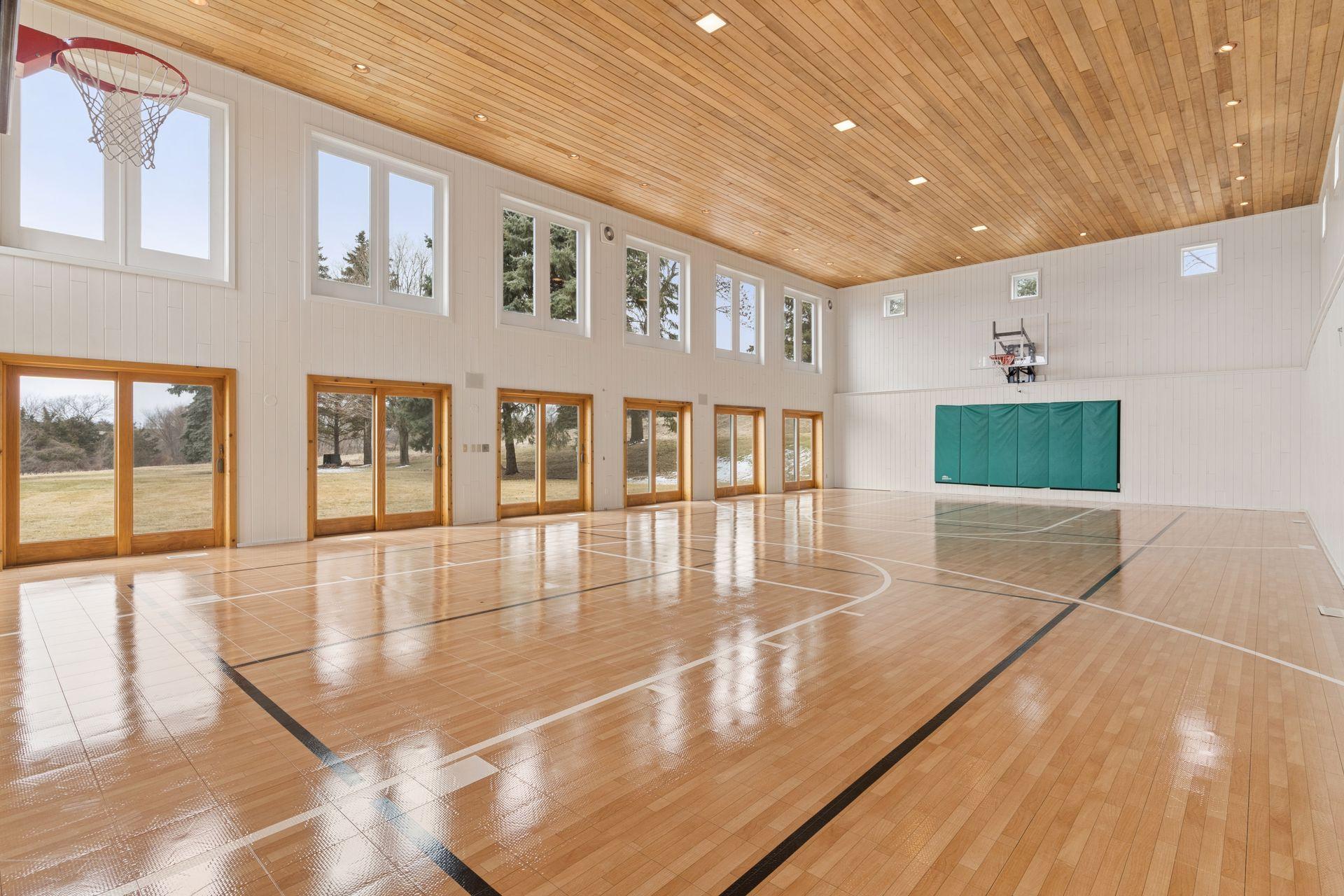 A rare opportunity! This indoor athletic court is filled with natural light and is connected to the home through the lower level.