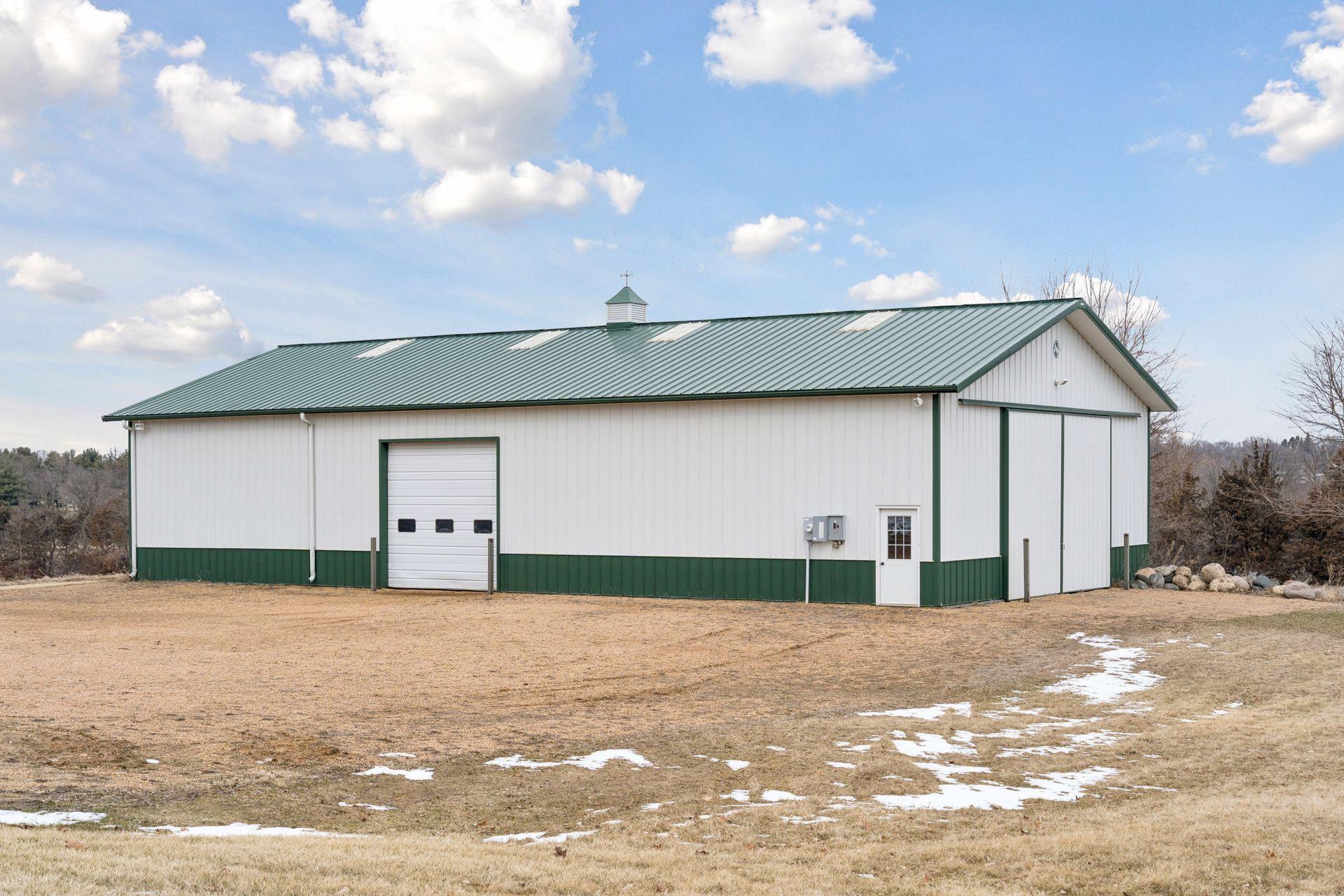 A Morton Building sits near the home.