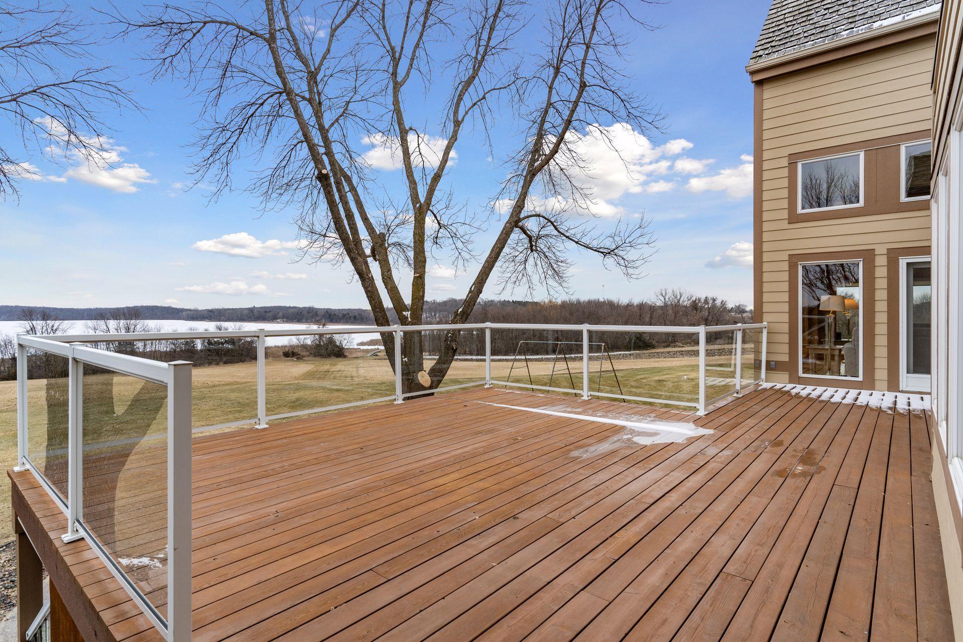 Step out to the spacious deck where you can connect with family and friends while enjoying this private setting.
