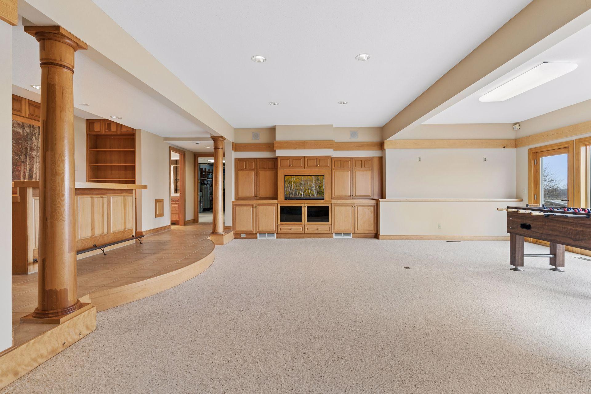 The lower level family room features a built-in entertainment center.