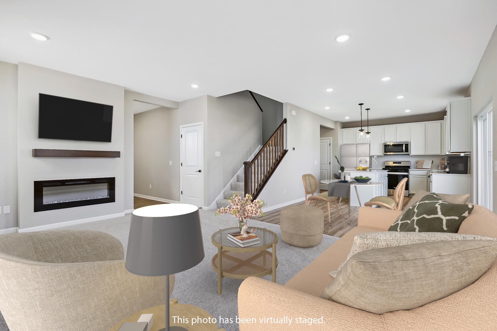 Macalester open floorplan creates a seamless connection between the family room, kitchen and dining area.jpg