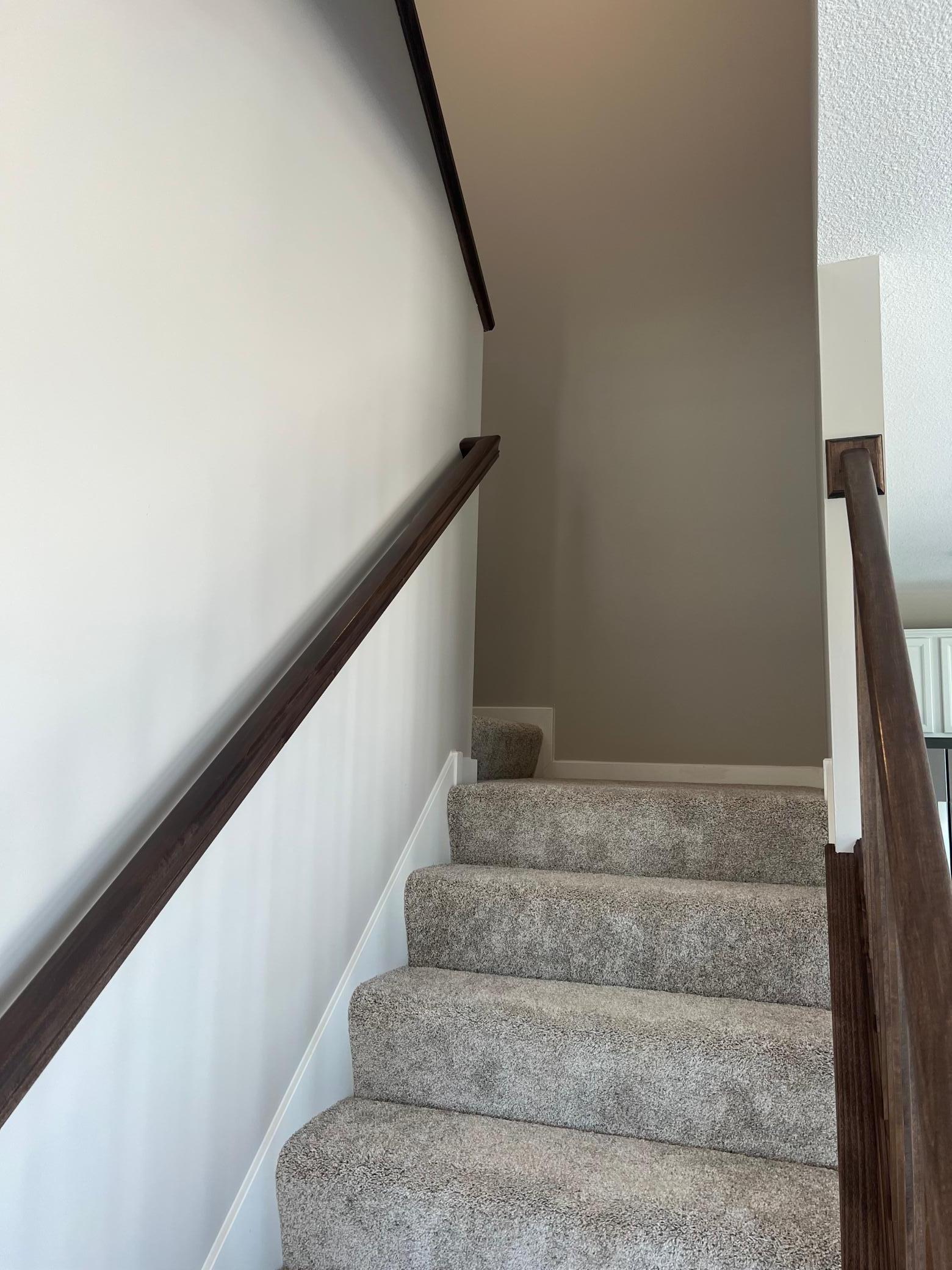 Central staircase leads to upstairs loft
