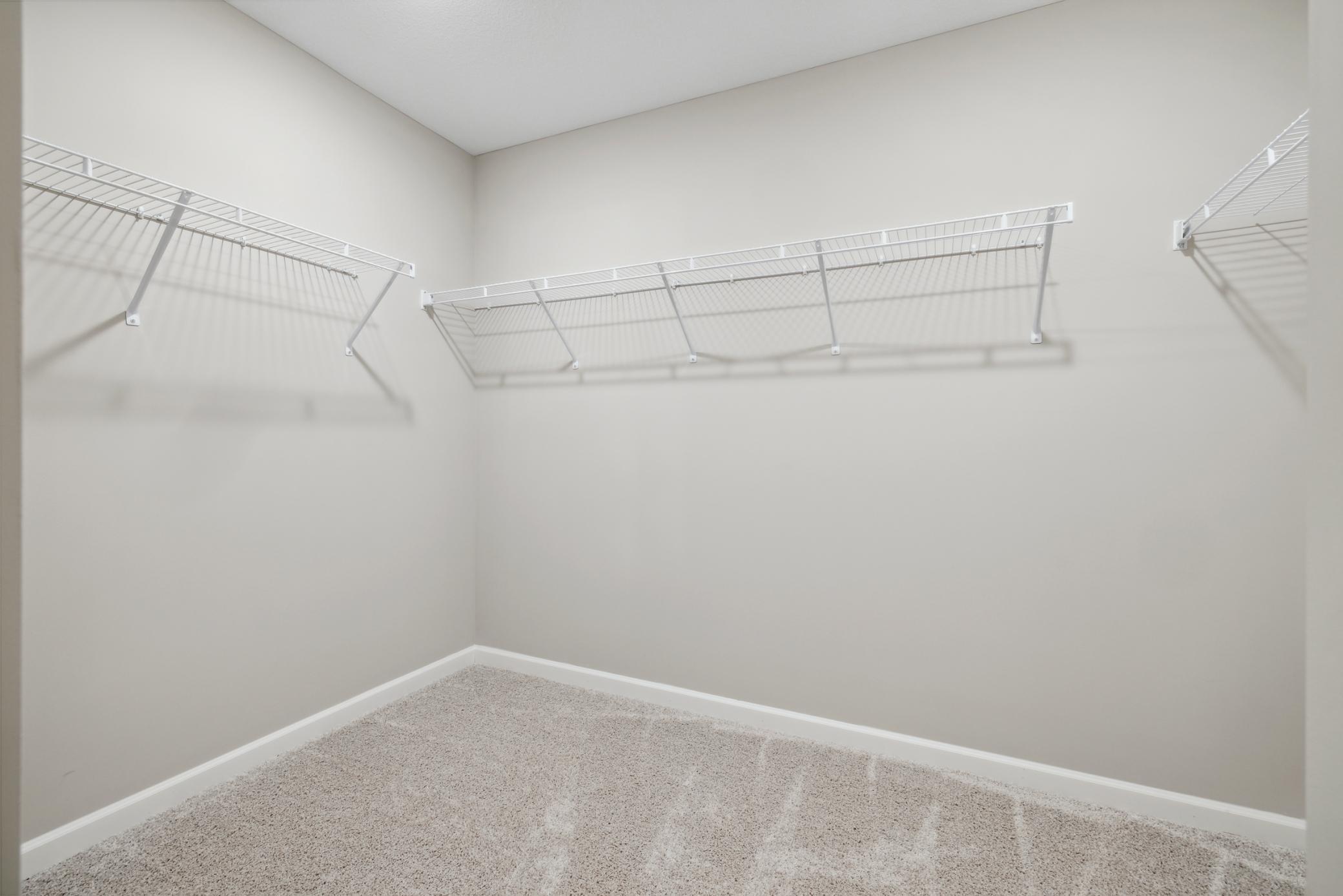 A large walk-on closet provides abundant storage and organization options