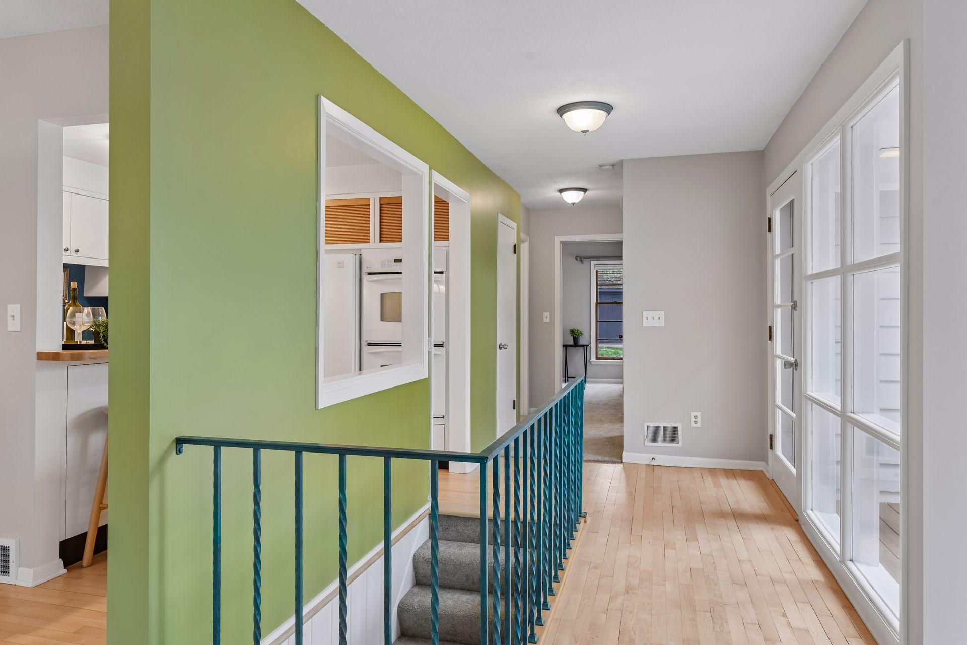 You'll love the thoughtful design of this efficient home. Large windows, an open stairway and strategic cutouts allow natural light reach all areas of the main level.