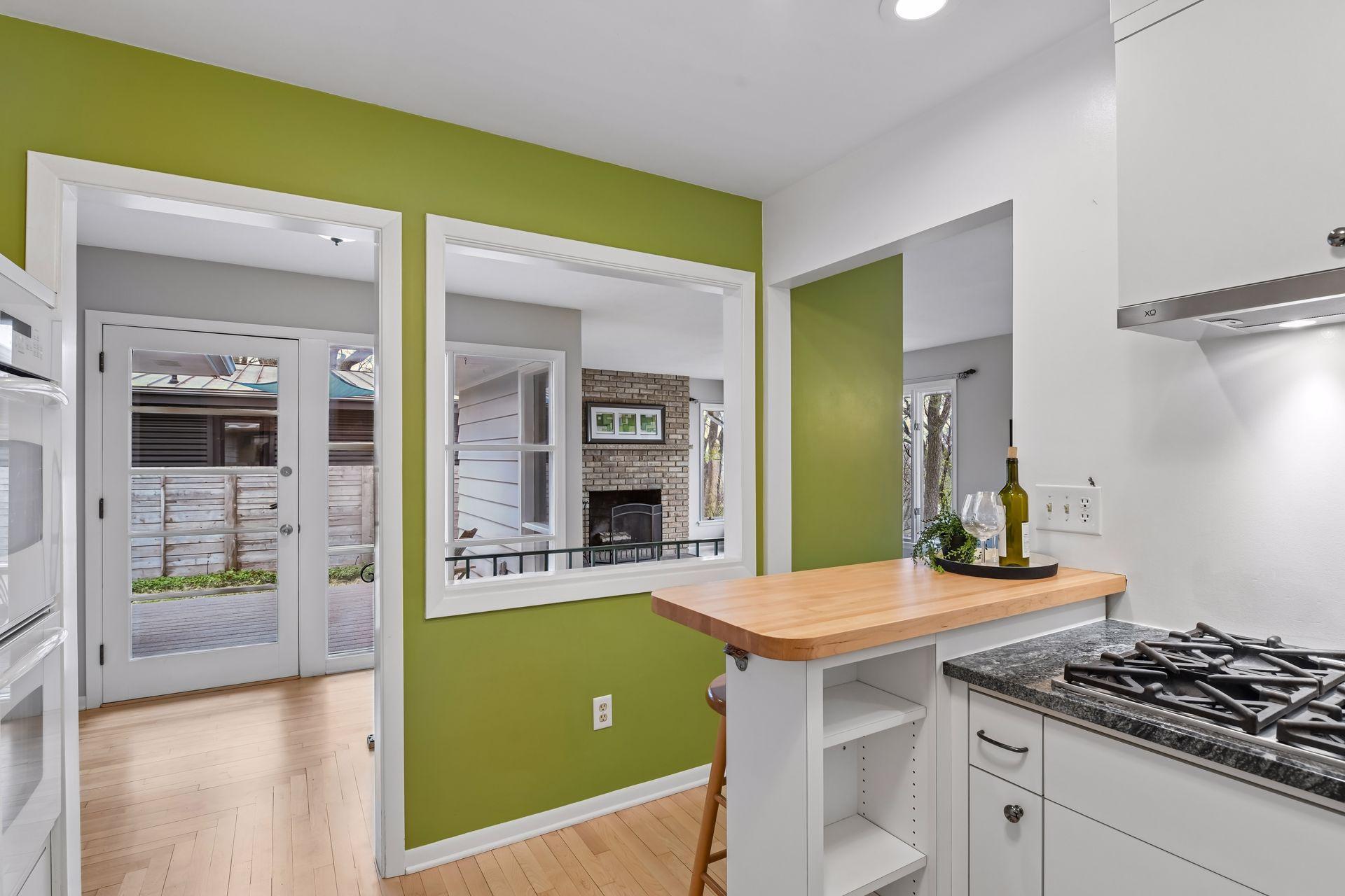 The kitchen is bright and cheerful with open sight lines to the living area. It is also convenient to the deck area - perfect for grilling season!