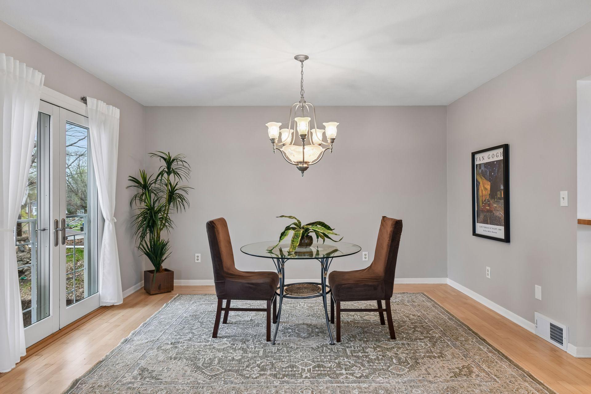 The generous formal dining area has gleaming hardwood floors, updated lighting and a charming french doors to a Juliette balcony. There's plenty of room for all your guests!