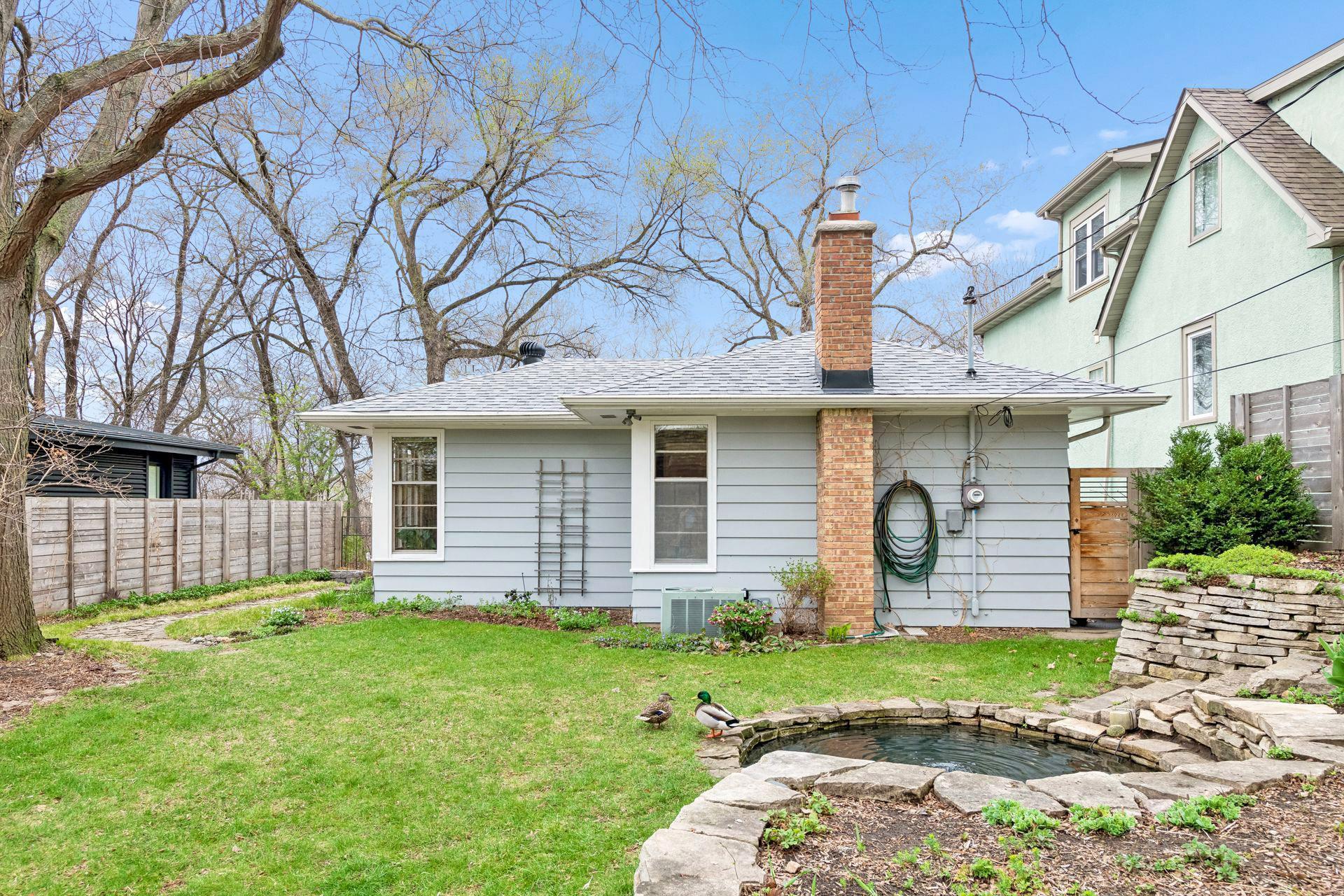 The stone rimmed koi pond has a pump and bubbler for aeration.