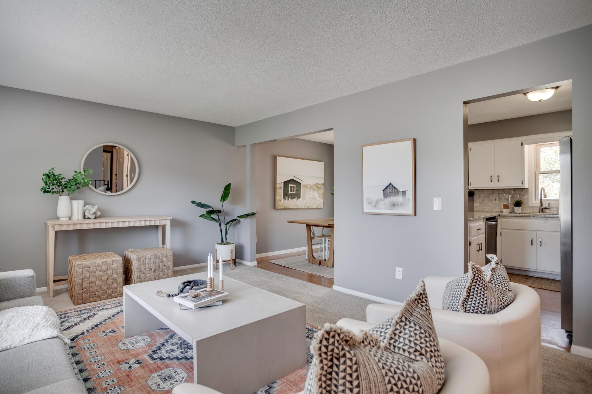 The main level features a sunny living room that flows into the dining room and kitchen