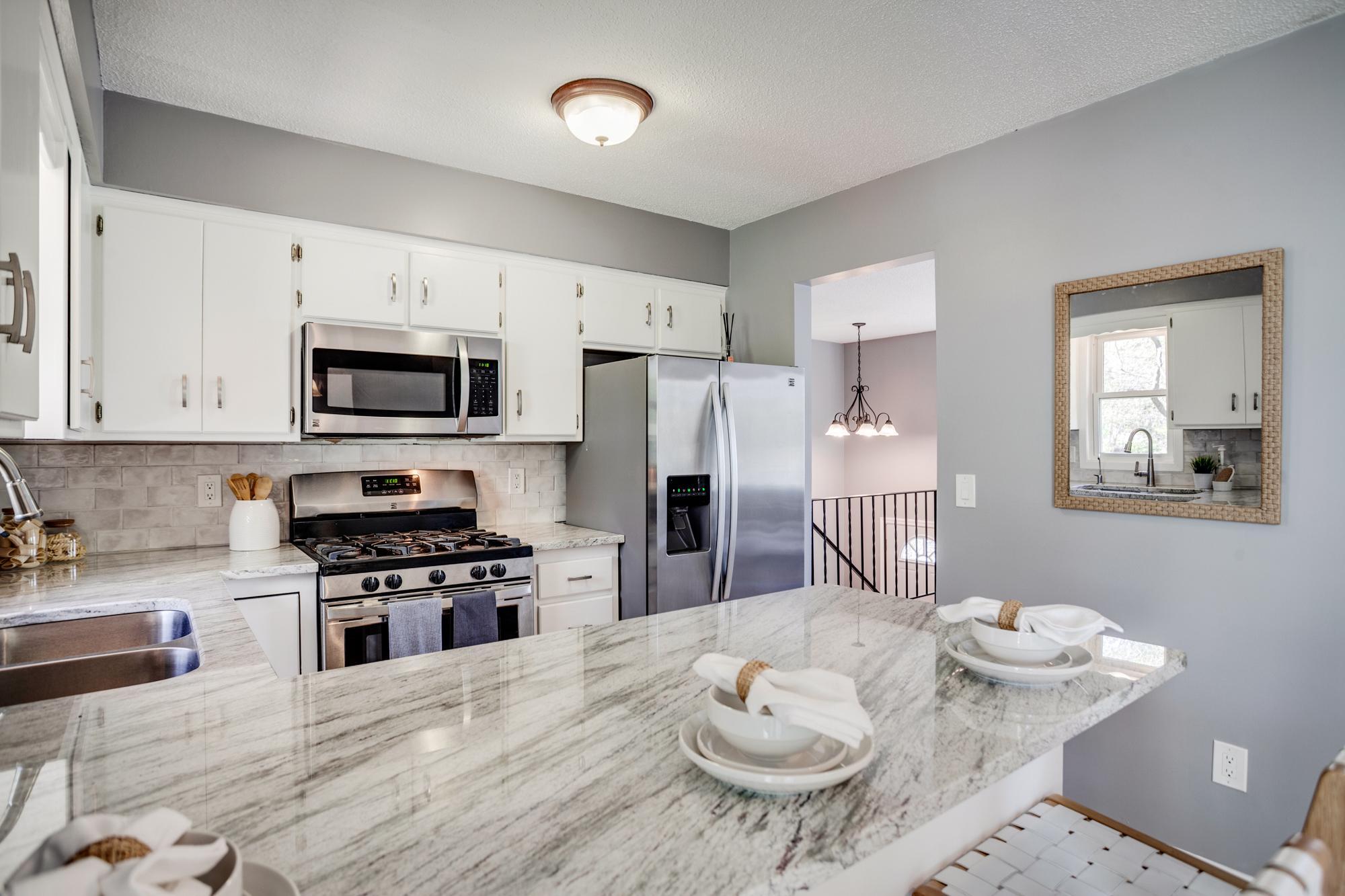 New granite countertops, backsplash, and painted cabinets in 2026