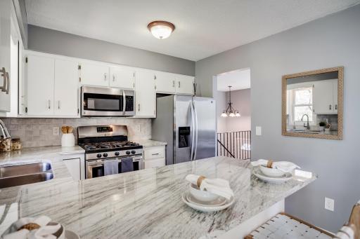 New granite countertops, backsplash, and painted cabinets in 2026