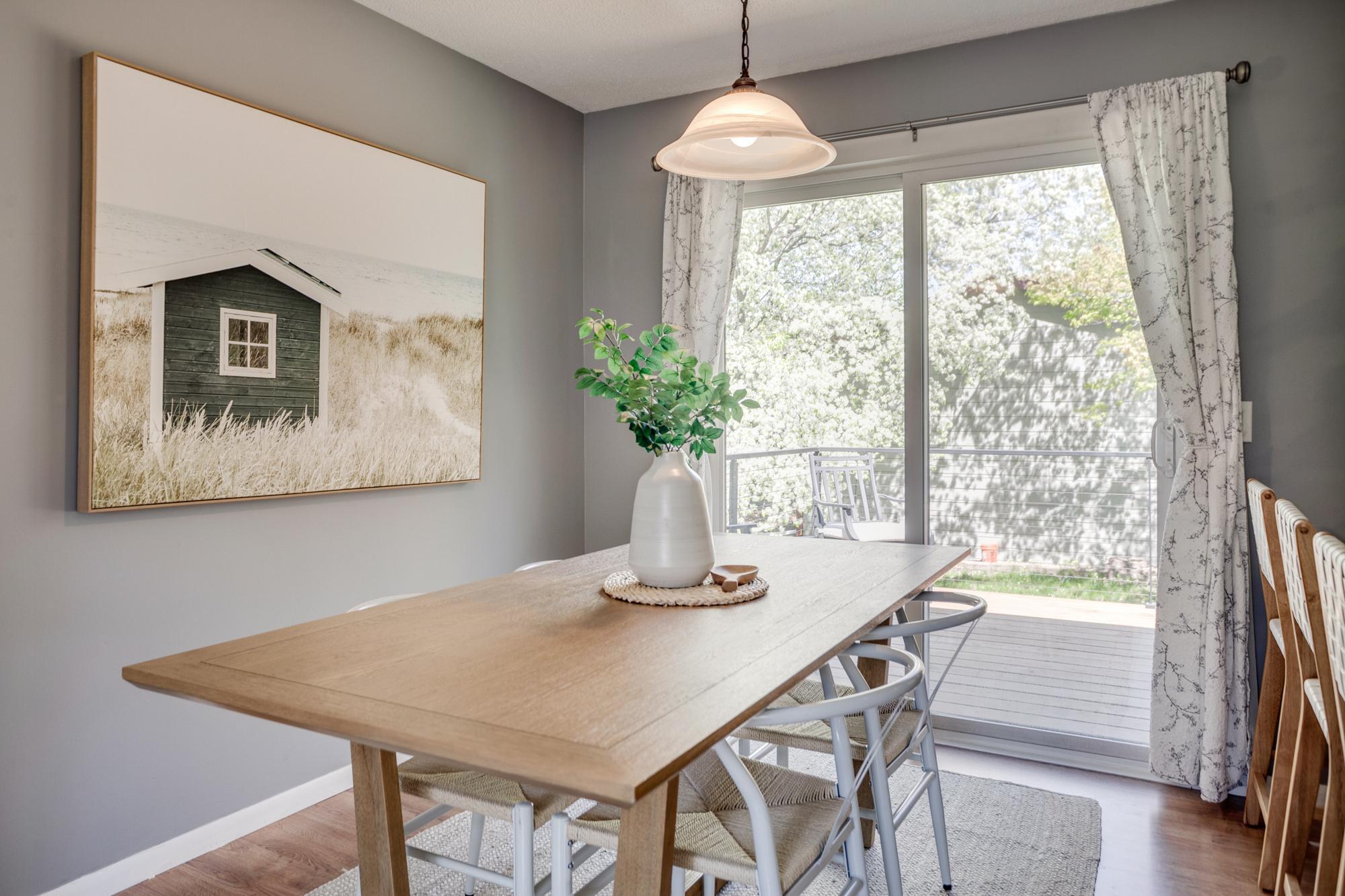 Sliding glass doors lead to the upper-level deck and spacious backyard