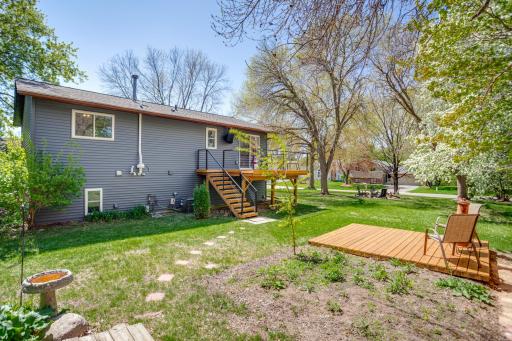 The generously sized yard has something for everyone with two decks, wildflower gardens, a fire pit, storage shed, and cedar privacy fencing