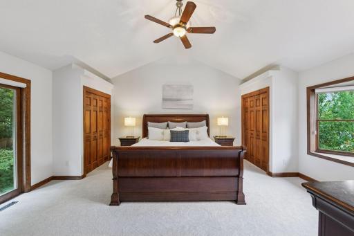 The upper level showcases the vaulted primary bedroom suite with three-quarter bathroom, two additional bedrooms, additional full bathroom, and a loft.