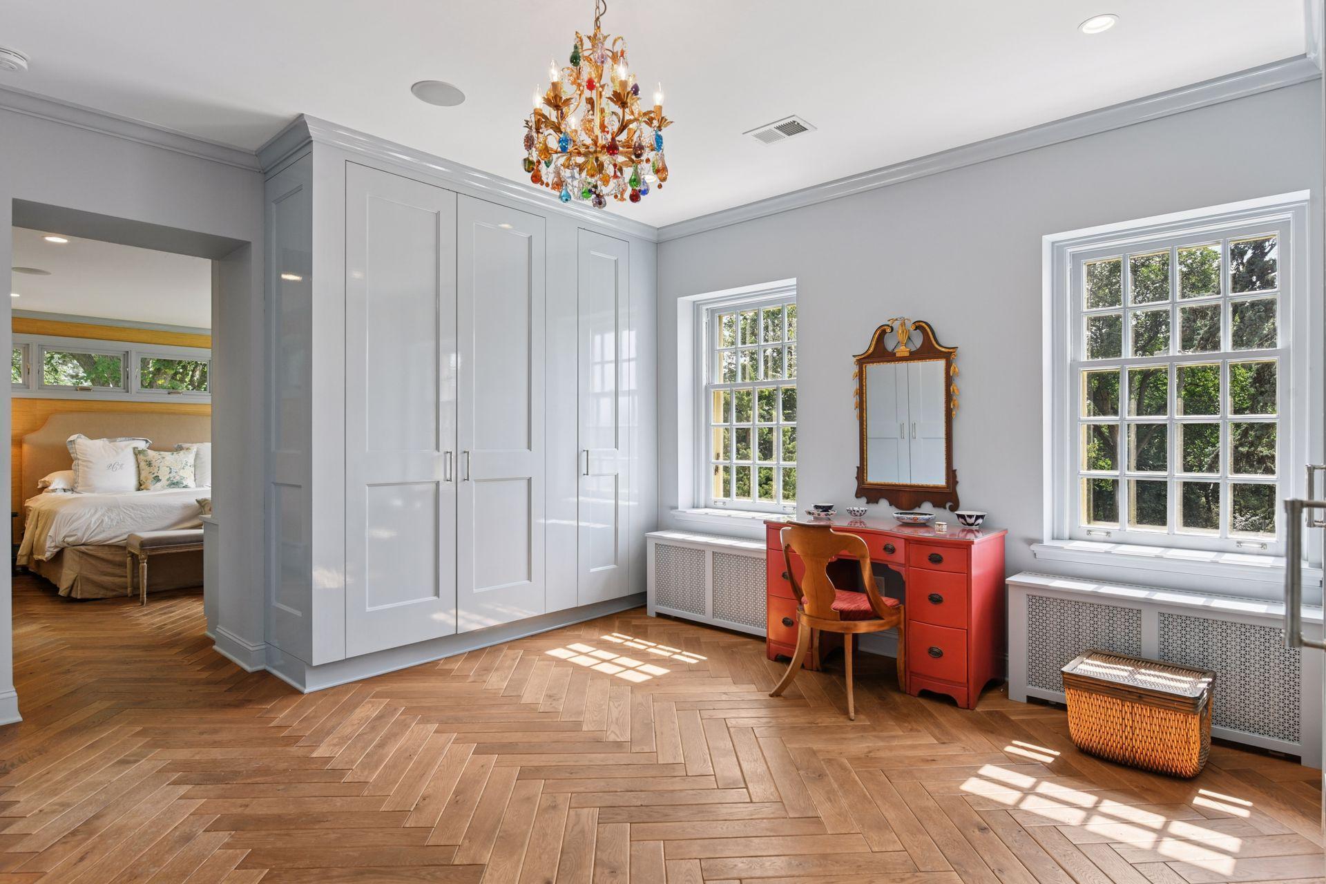 Oversized dressing room with numerous custom closets