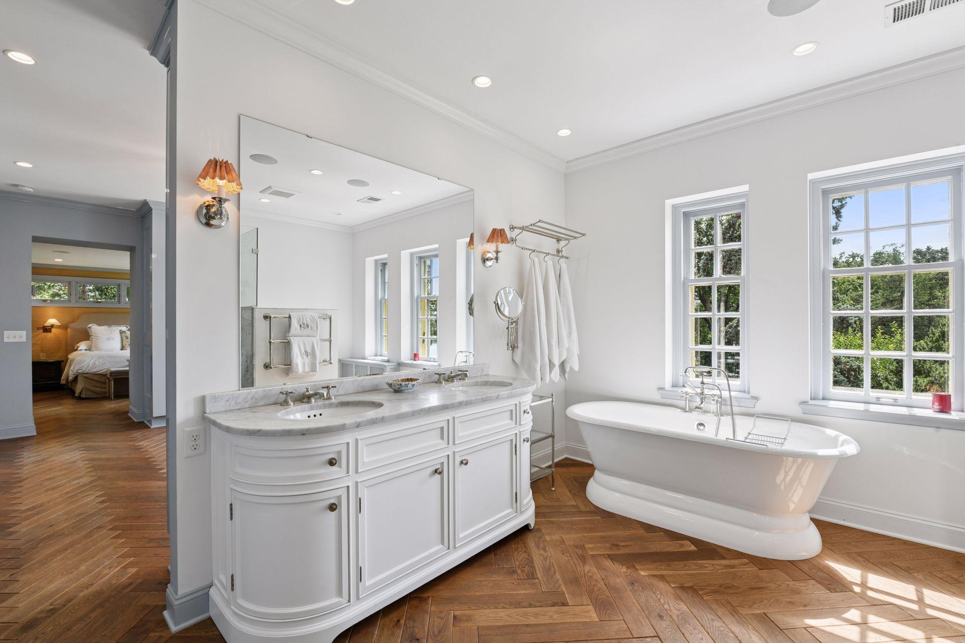 Large bathroom with custom cabinets and large soaking tub