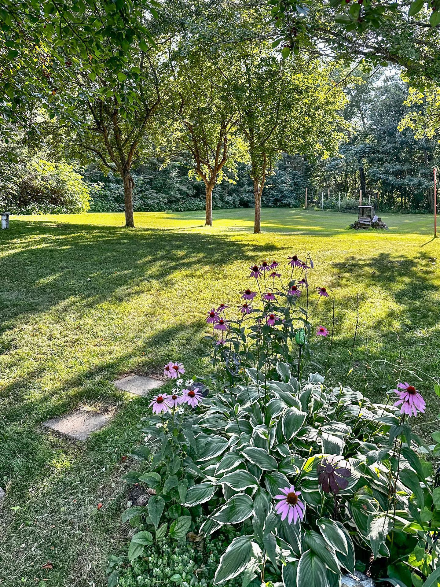 Beautiful landscaping enhances both privacy and curb appeal.