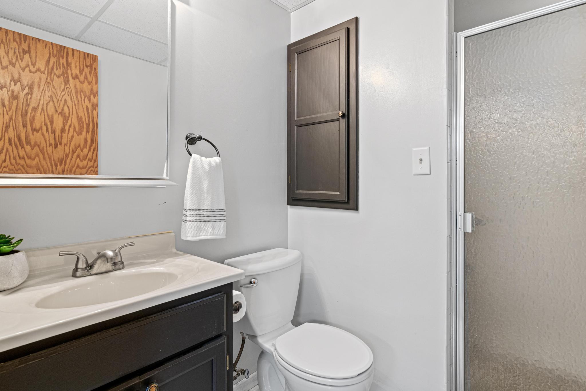 Well-appointed bathrooms conveniently located throughout the home. This bathroom is located in the lower level.