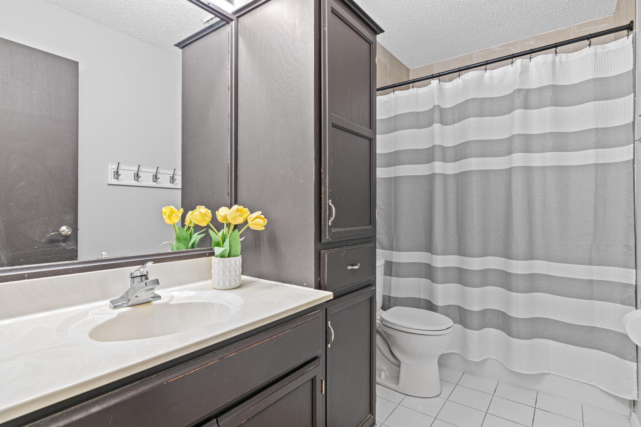 Main floor full bathroom located near the three bedrooms.