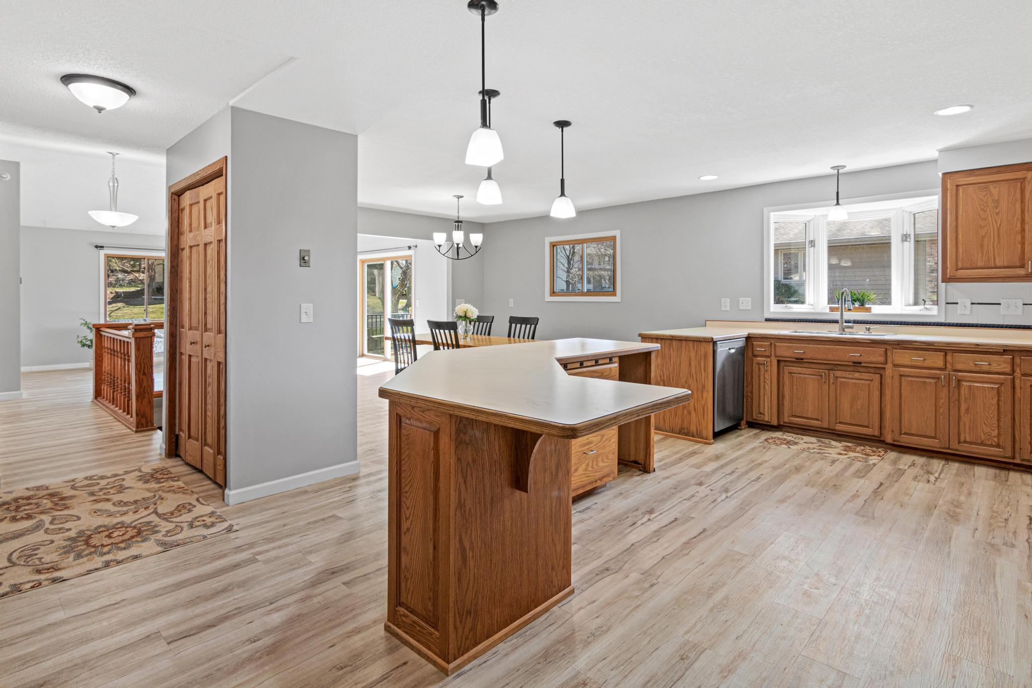 Spacious kitchen featuring abundant cabinetry, generous counter space, and newer stainless steel appliances.